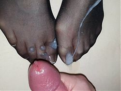 Black nylon sock on Wifes french toenails in detail covered by big cum load